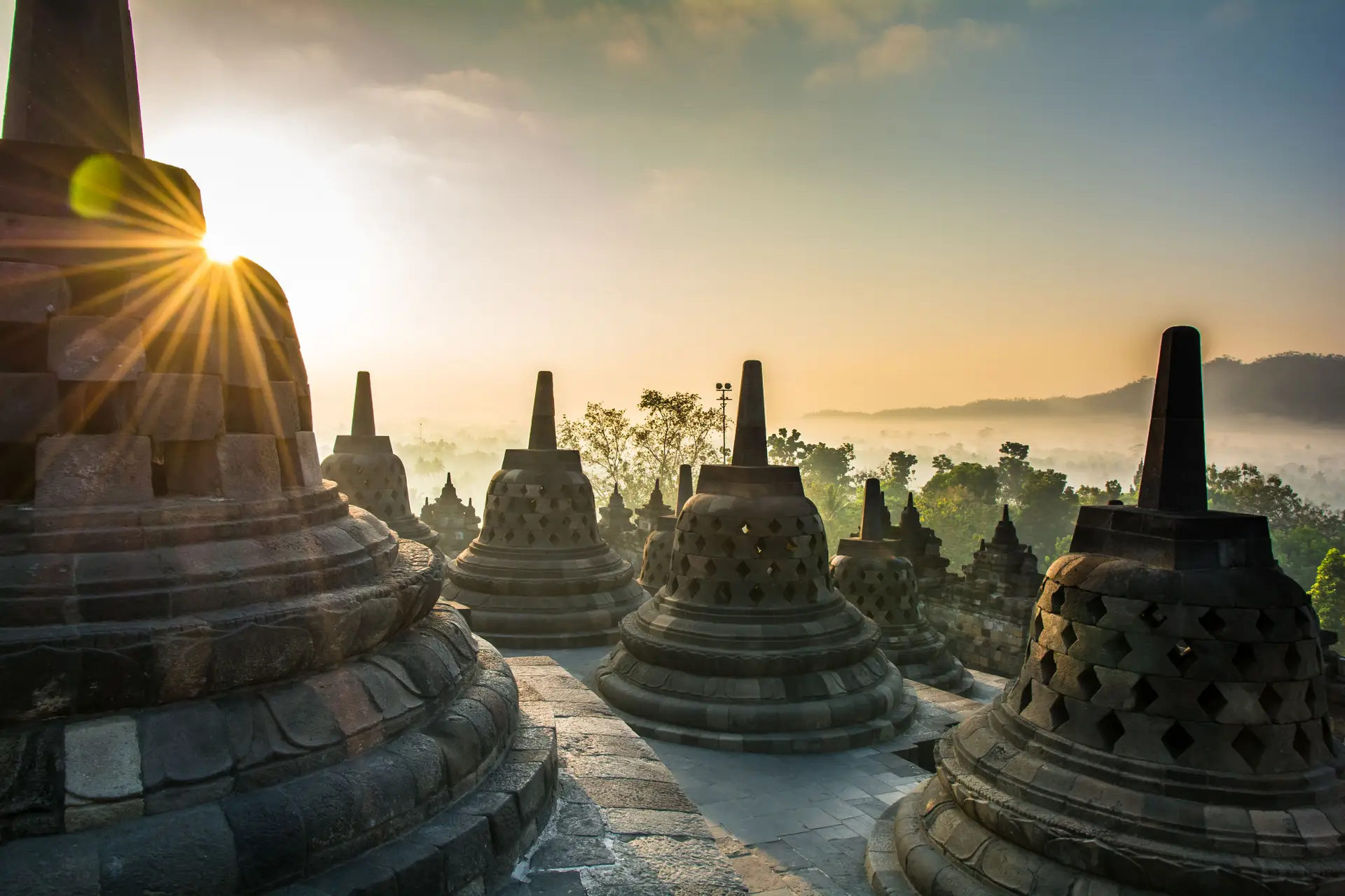Travel in Asia - Sunset over the stupas at Borobudur temple on the island of Java in Indonesia