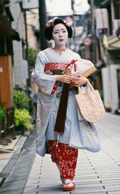 Travel in Asia - Geisha walking down a street in Kyoto