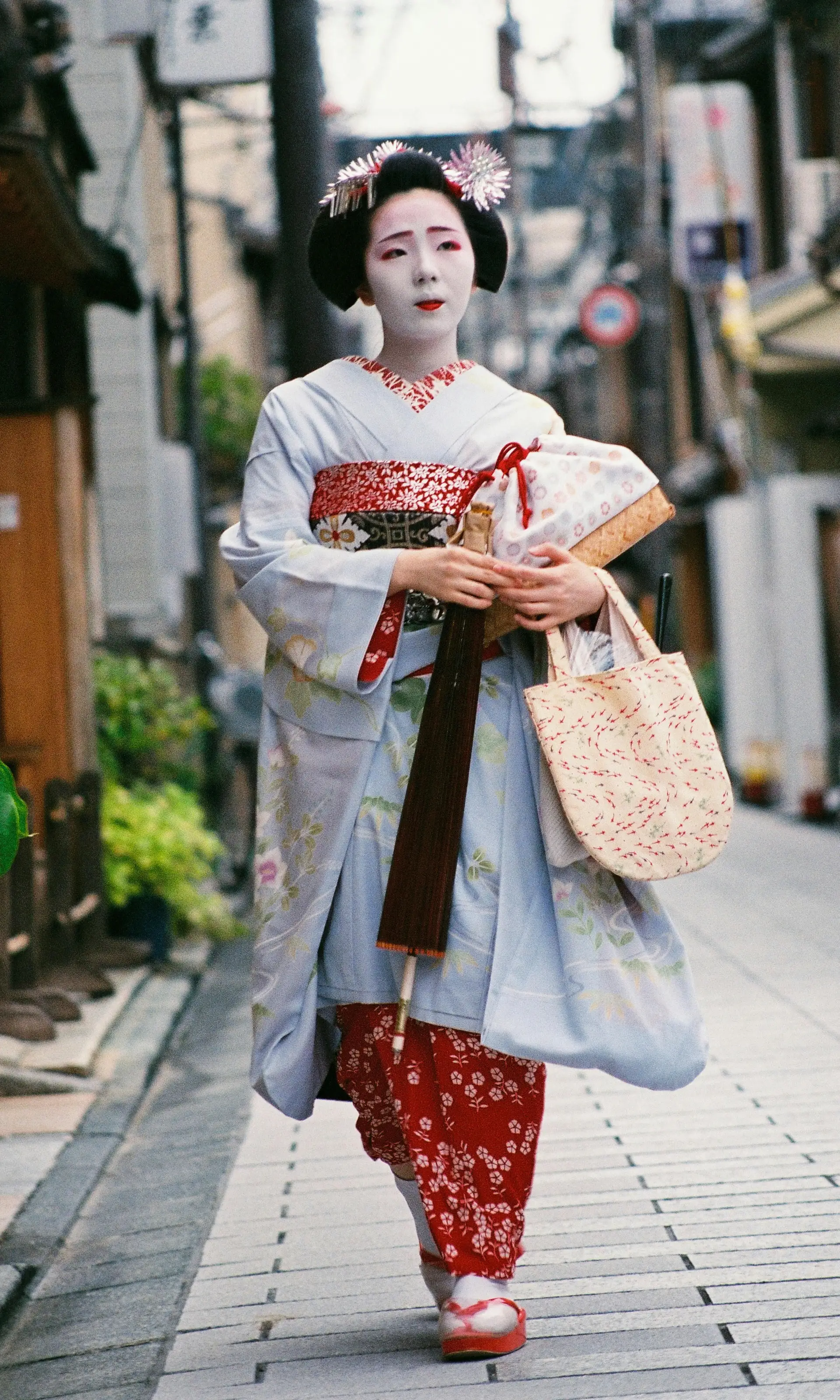 Travel in Asia - Geisha walking down a street in Kyoto