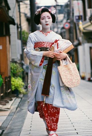 Travel in Asia - Geisha walking down a street in Kyoto