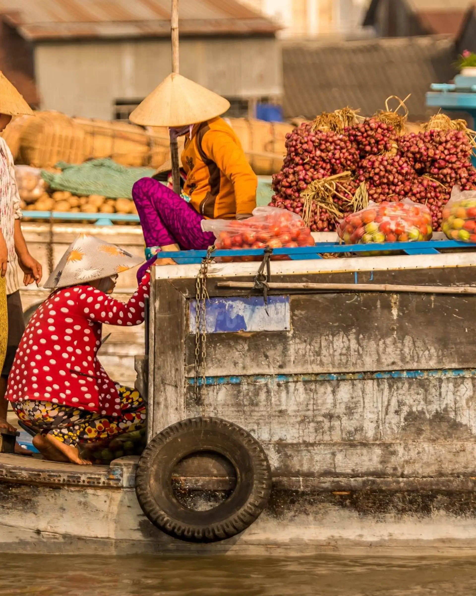 Travel in Asia - People at a floating market on a boat in Vietnam