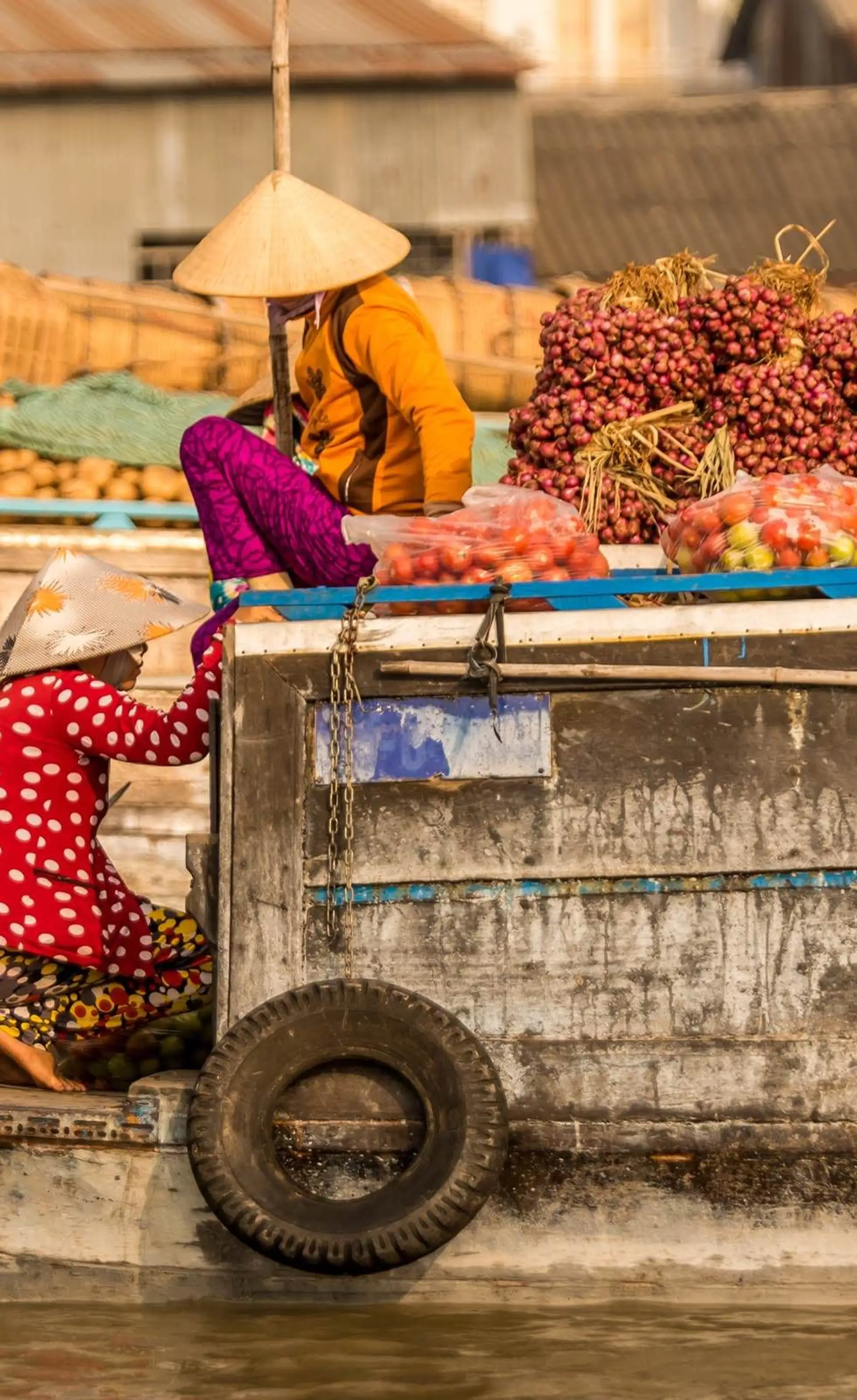 Travel in Asia - People at a floating market on a boat in Vietnam