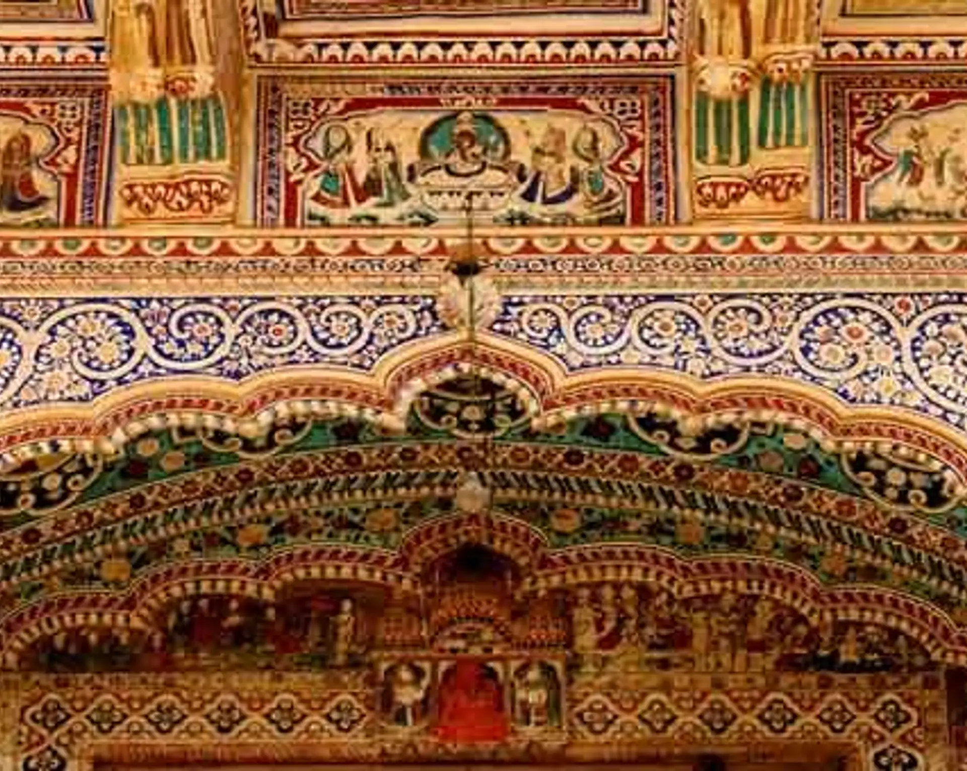 Travel in Asia - Richly decorated archway and upper frieze in a frescoed haveli in the Shekhawati region of Rajasthan, India