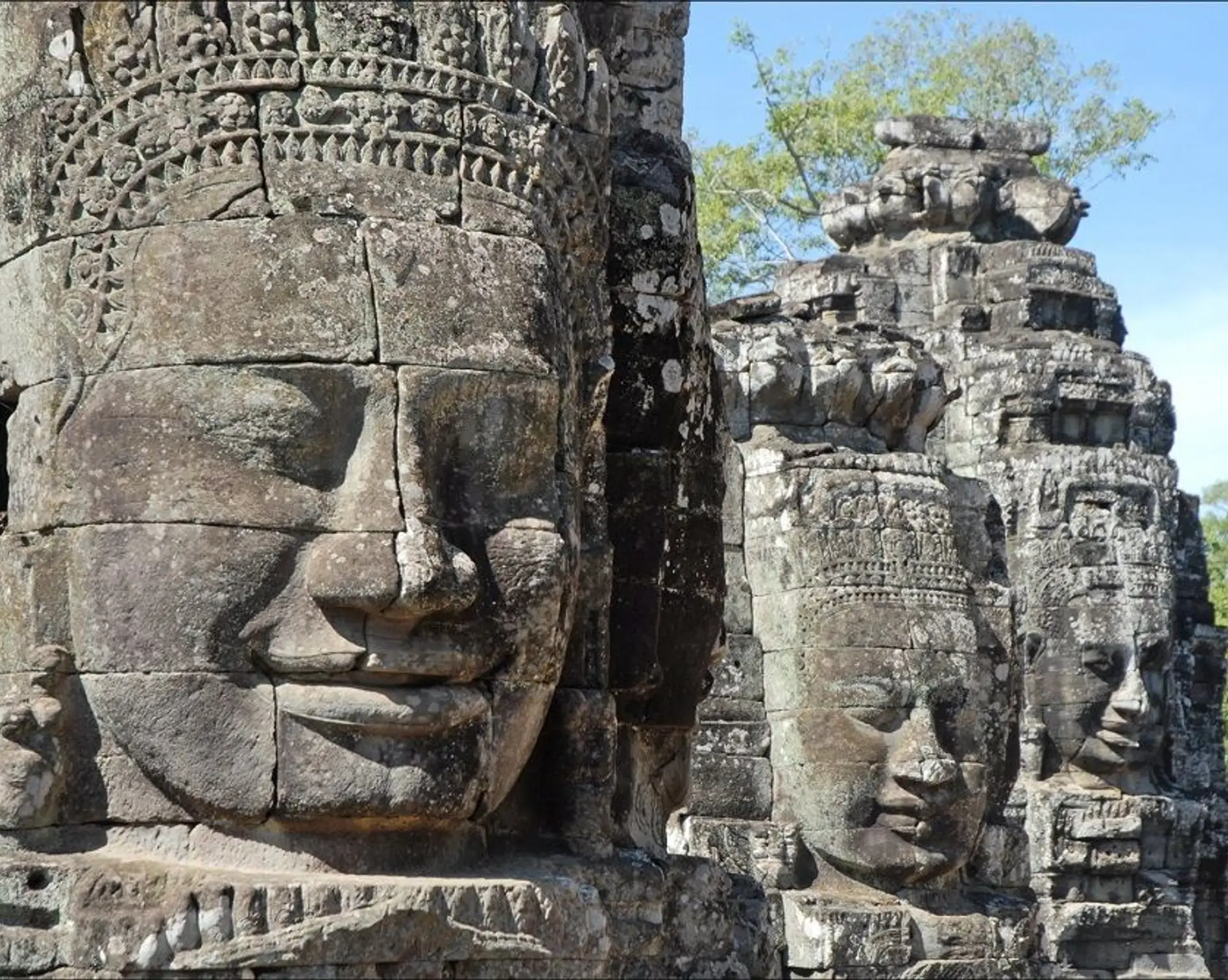 Travel in Asia - Giant stone faces of the Bayon Temple in Angkor Thom, Cambodia