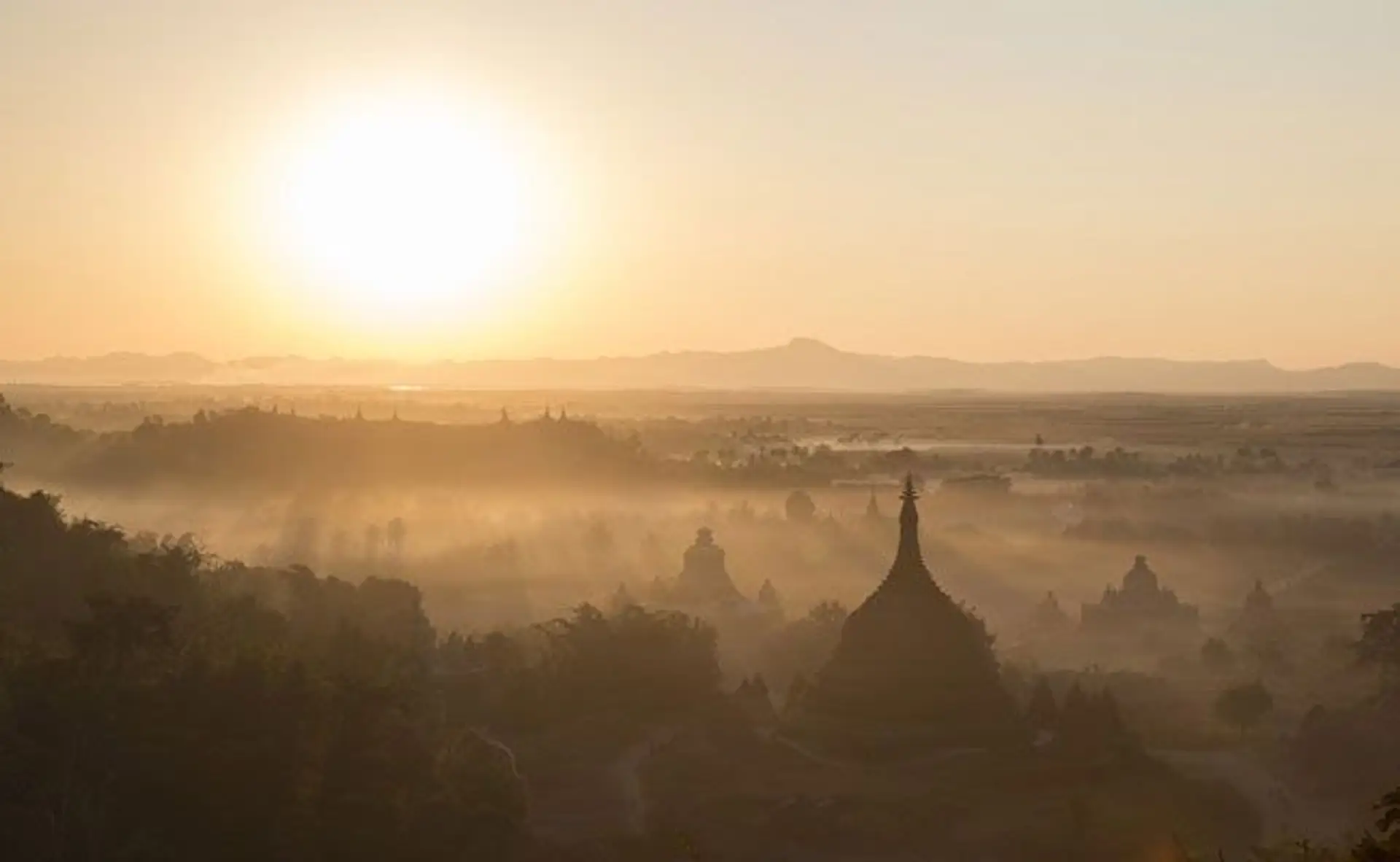 Travel in Asia - Sunrise over the stupas of the city of Mrauk-U in Myanmar