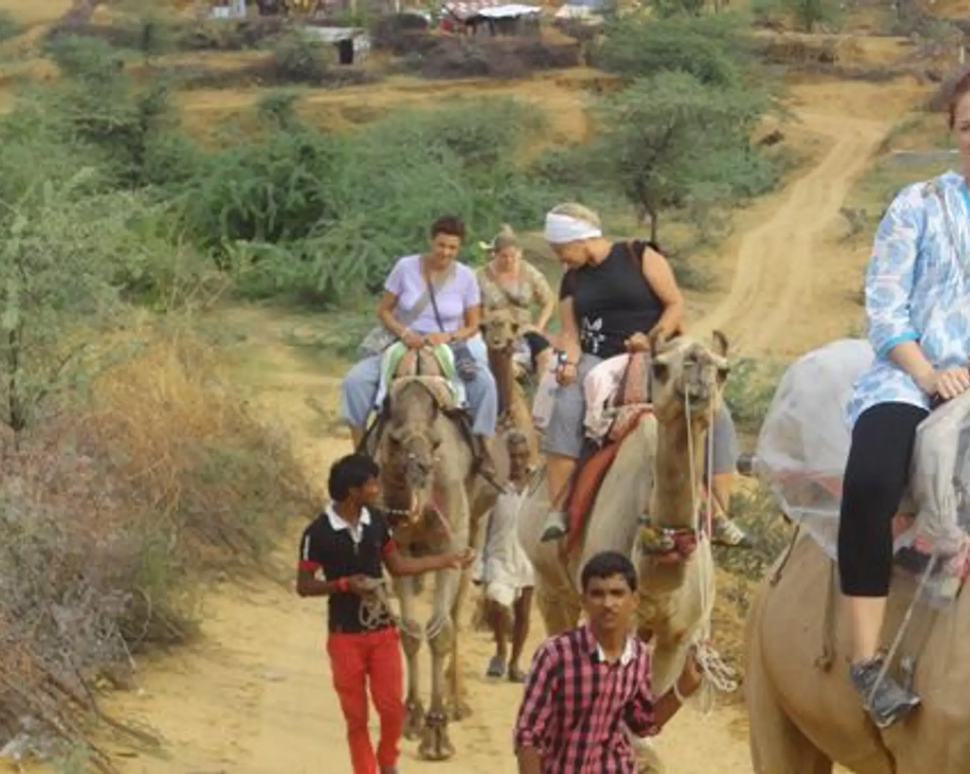Travel in Asia - People on a camel safari in the Thar Desert of Rajasthan