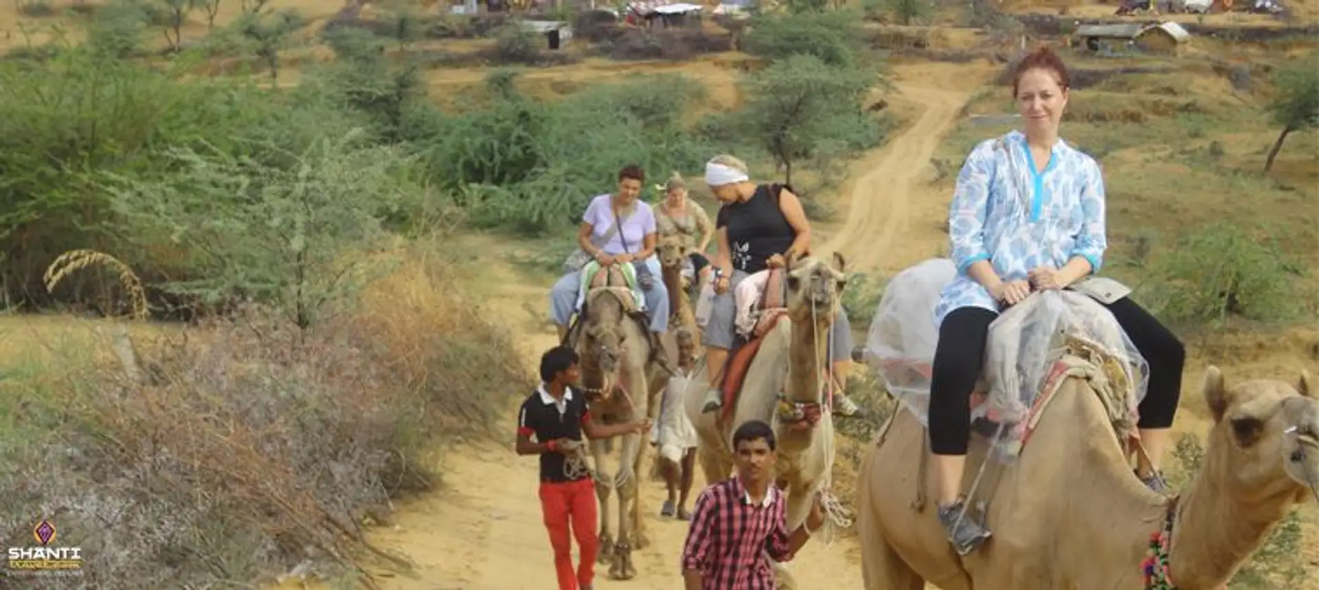 Travel in Asia - People on a camel safari in the Thar Desert of Rajasthan
