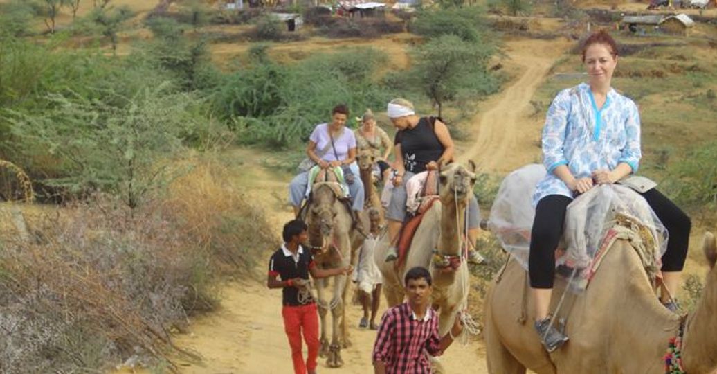 Travel in Asia - People on a camel safari in the Thar Desert of Rajasthan