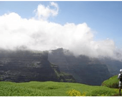 Travel in Asia - Hiker stopping to admire a mountain view in Horton Plains National Park, Sri Lanka