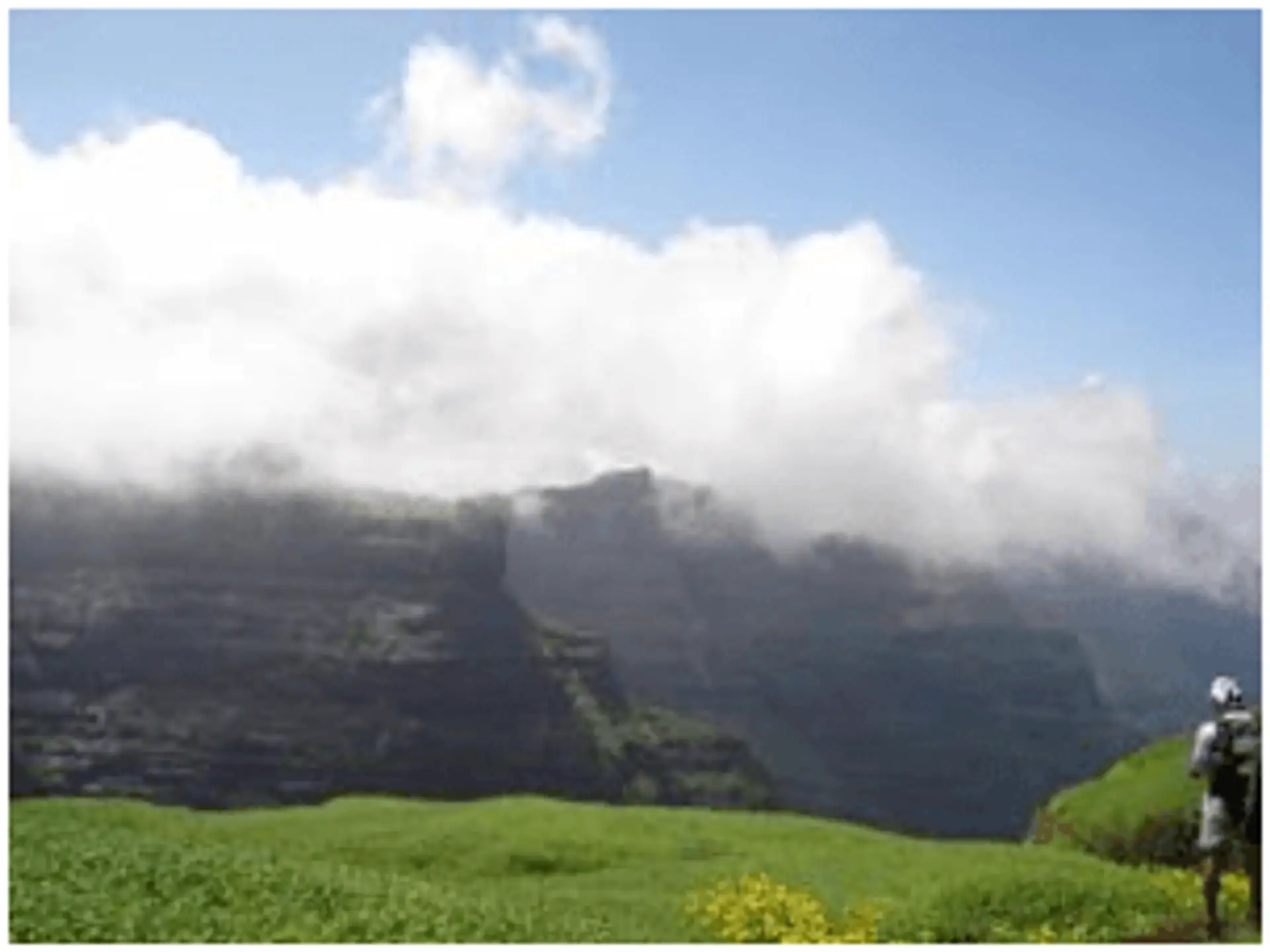 Travel in Asia - Hiker stopping to admire a mountain view in Horton Plains National Park, Sri Lanka