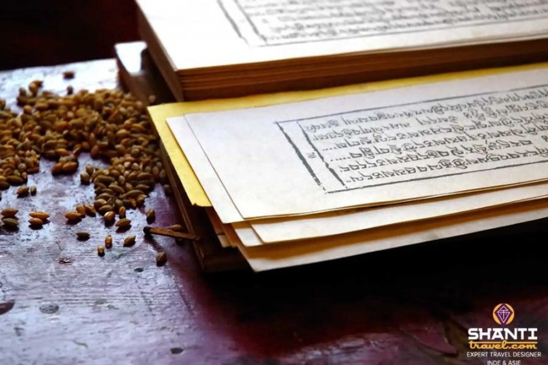 Travel in Asia - A Tibetan prayer book open on a table