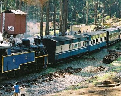 Travel in Asia - A steam engine pulling a Nilgiri Mountain Railway train in India