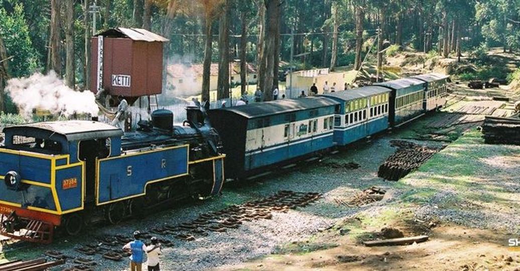 Travel in Asia - A steam engine pulling a Nilgiri Mountain Railway train in India