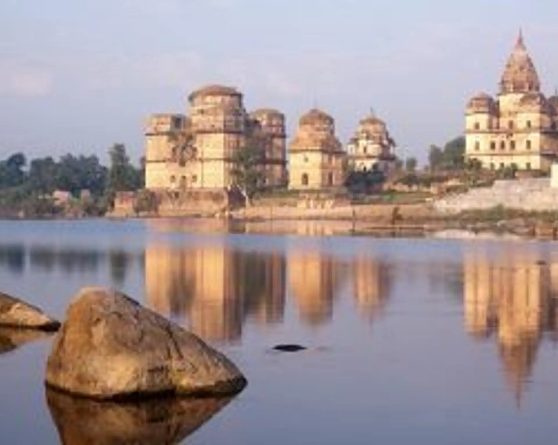 Travel in Asia - Jahangir Mahal and other temples reflected in the Betwa River in Orchha, India