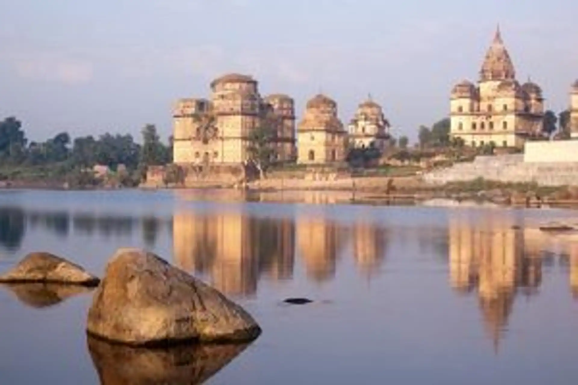 Travel in Asia - Jahangir Mahal and other temples reflected in the Betwa River in Orchha, India