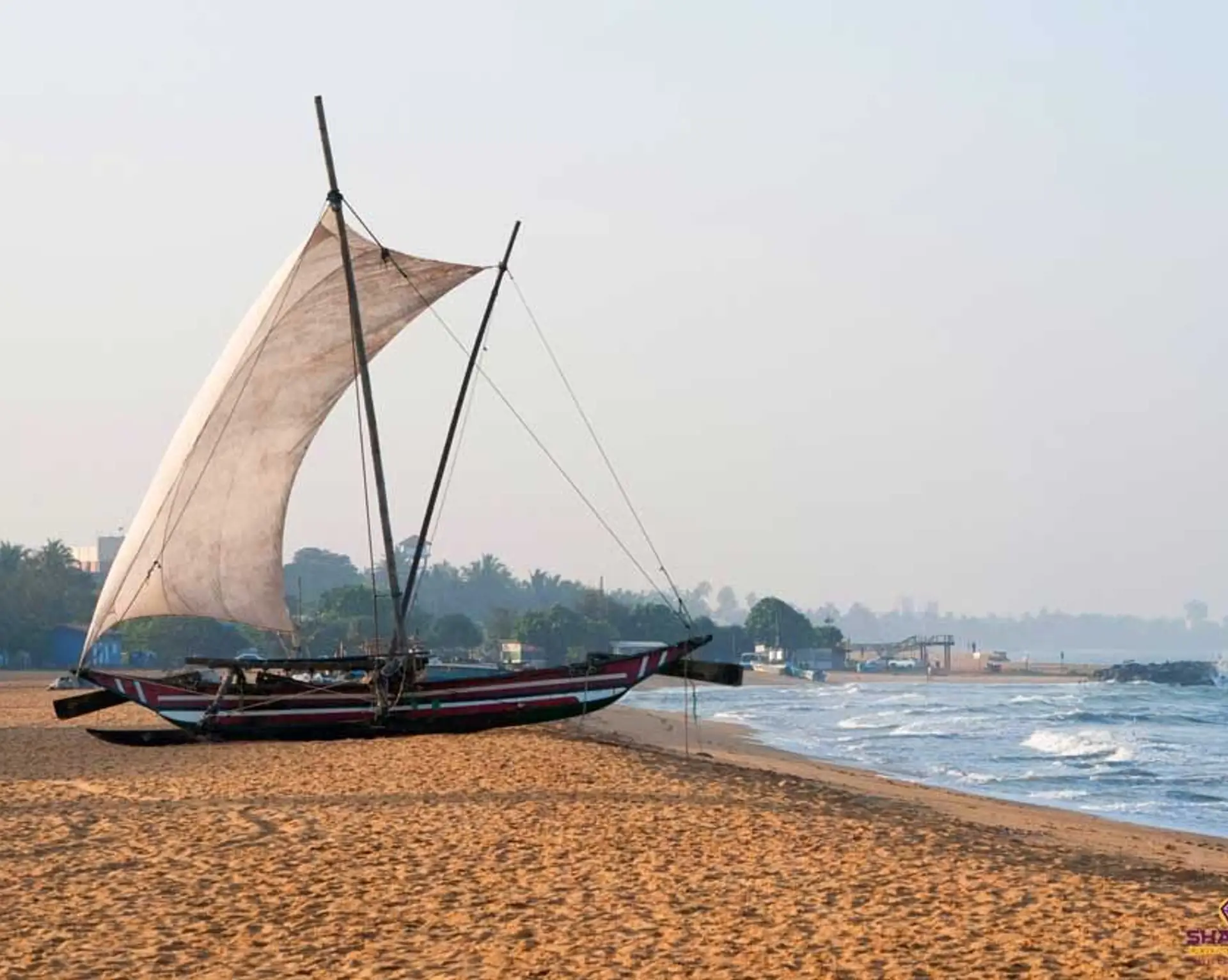 Travel in Asia - A Sri Lankan fishing boat, known as Oruwa, on the beach at Negombo, Sri Lanka