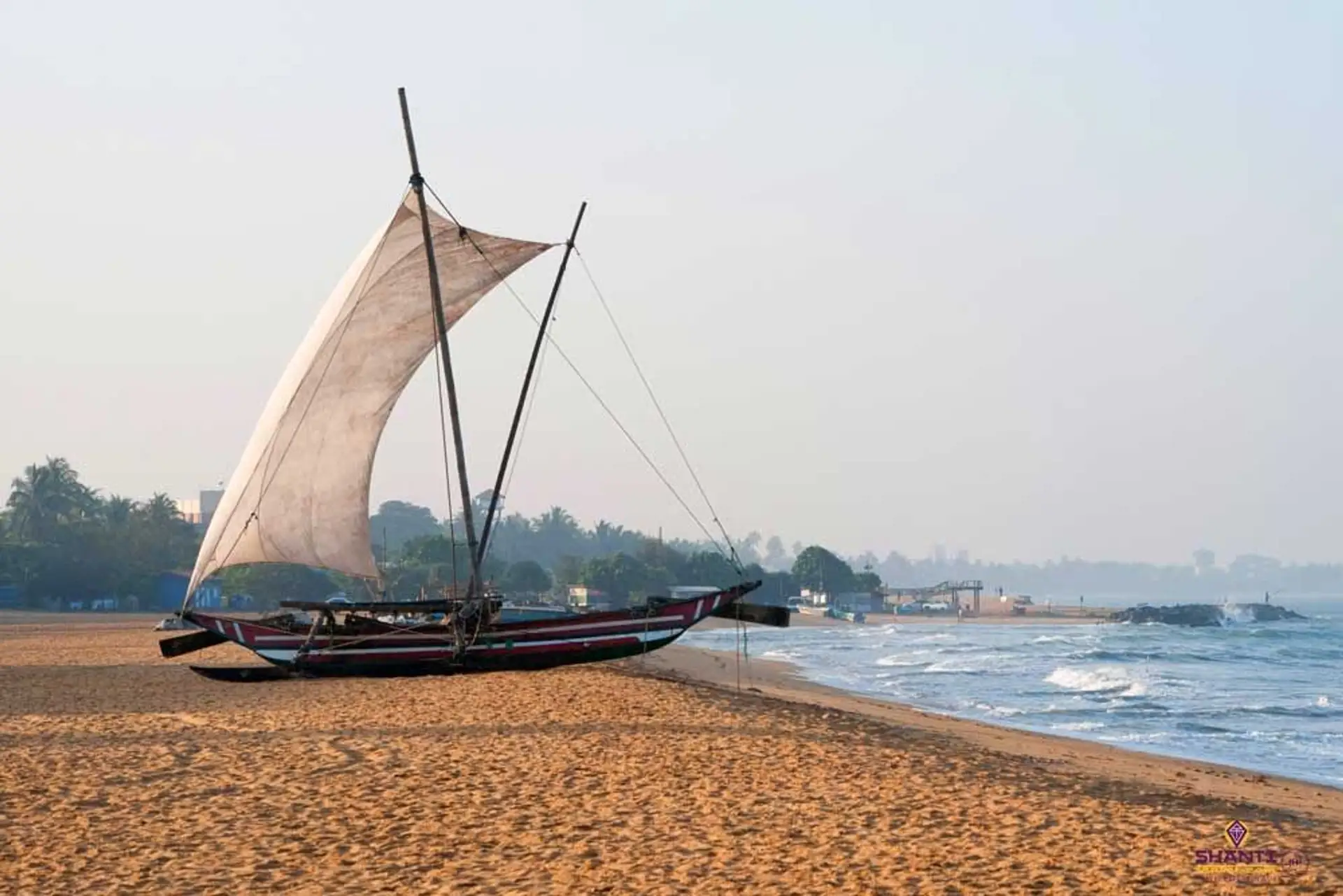Travel in Asia - A Sri Lankan fishing boat, known as Oruwa, on the beach at Negombo, Sri Lanka