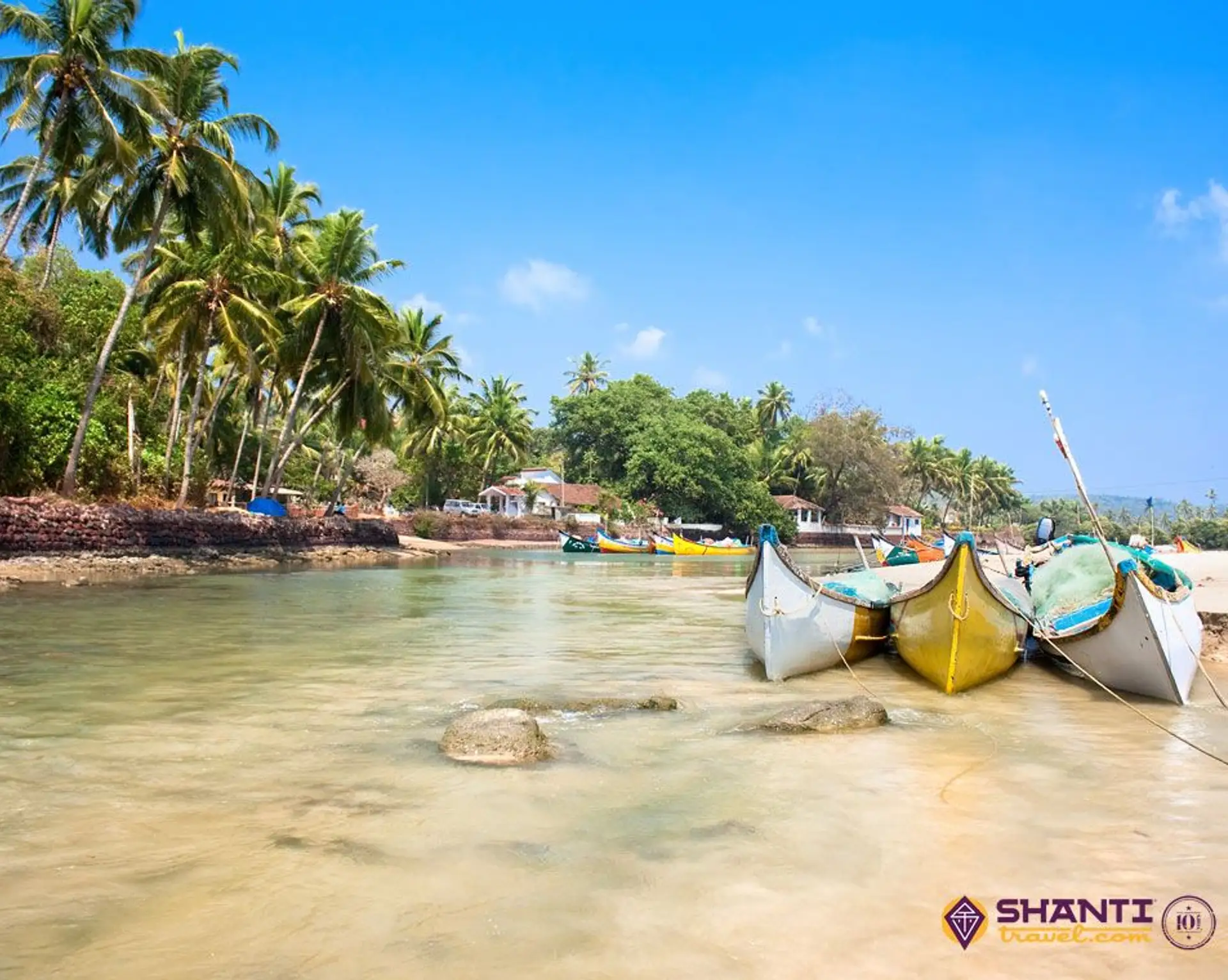 Travel in Asia - Boats lined up along a beach on Baga Beach in Goa, India