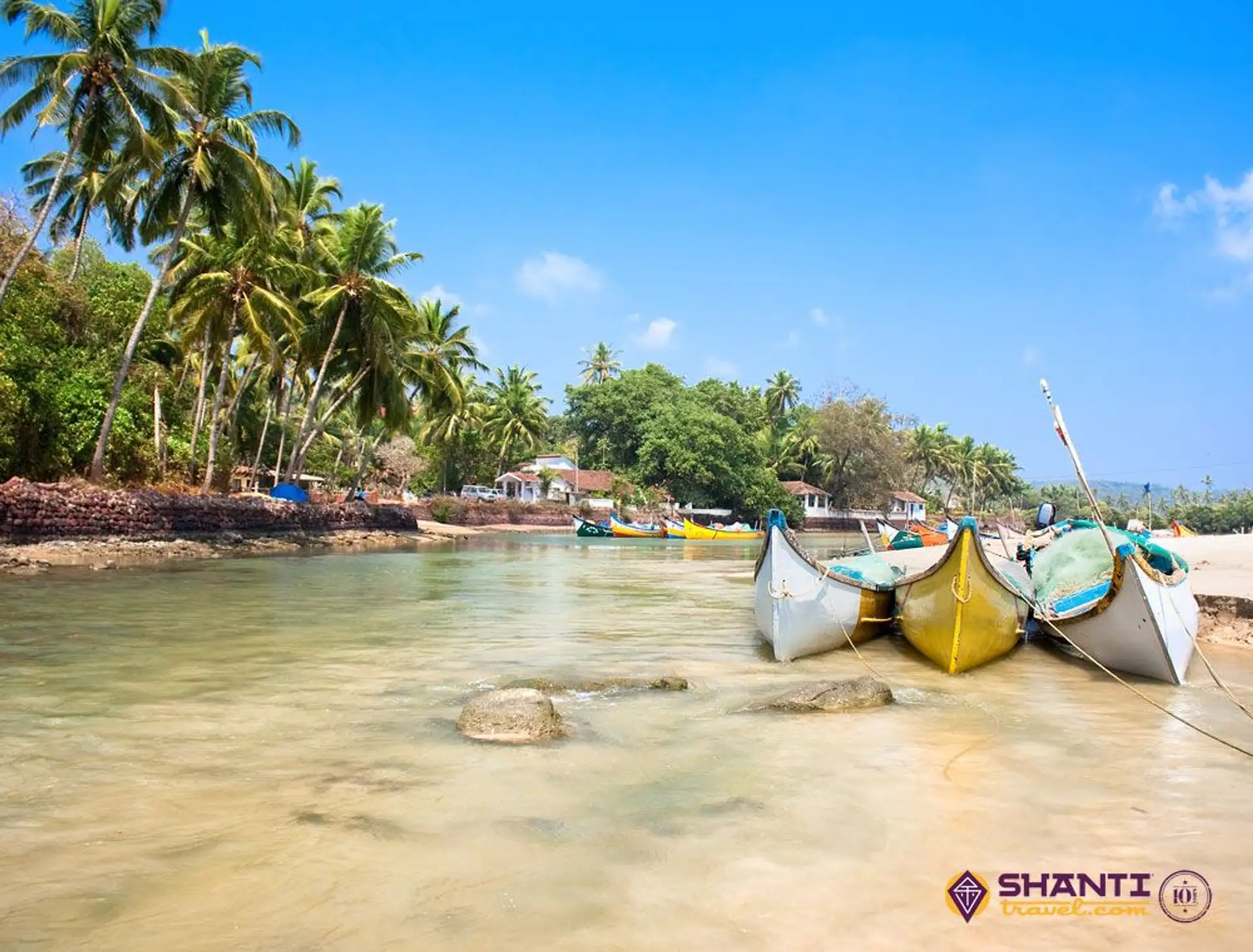 Travel in Asia - Boats lined up along a beach on Baga Beach in Goa, India