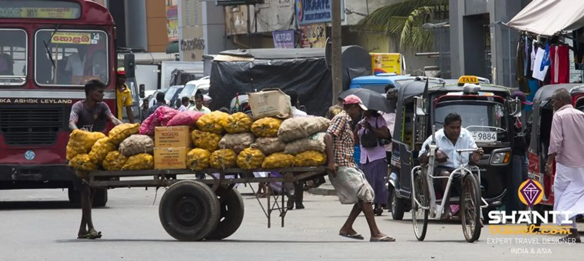 Travel in Asia - Street vendors and tuk tuk driver in the streets of the Pettah Market area of Colombo, Sri Lanka