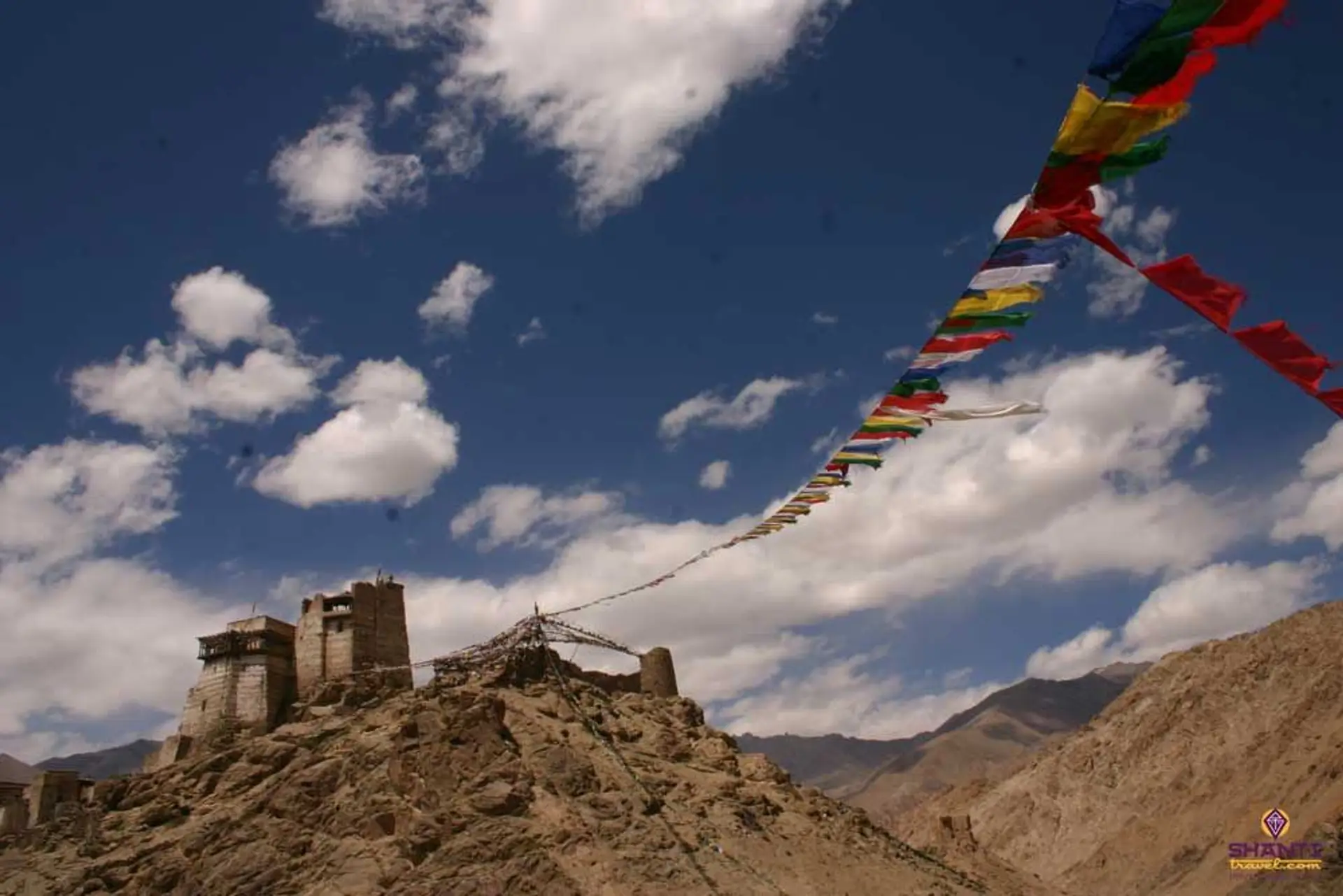 Travel in Asia - Prayer flags blowing in the wind at the Leh Palace in Ladakh, India