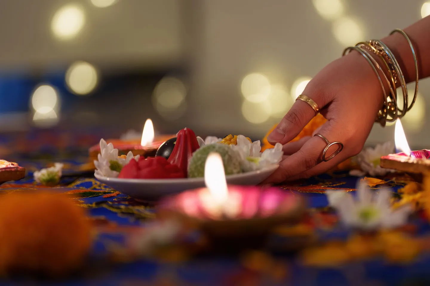 diwali-celebration-hand-placing-decorative-sweets-2025-09-10-19-03-24-utc (1).jpg