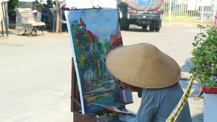 Un peintre dans les rues indonésiennes