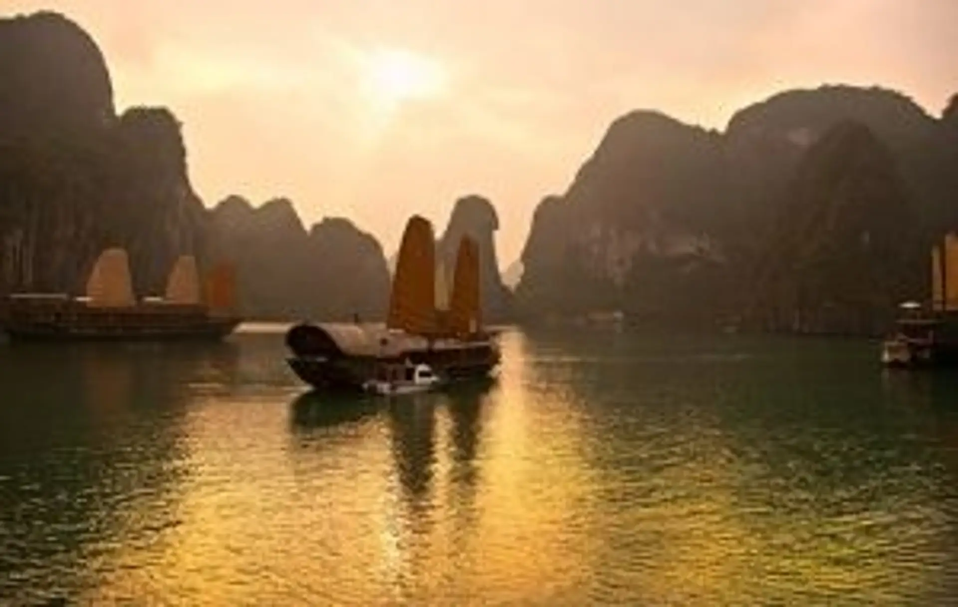 Travel in Asia - Boats floating at sunset in Hạ Long Bay, Vietnam