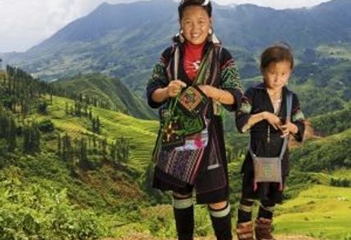 Travel in Asia - Members of the Black Hmong hill tribe standing in a mountainous landscape in Vietnam