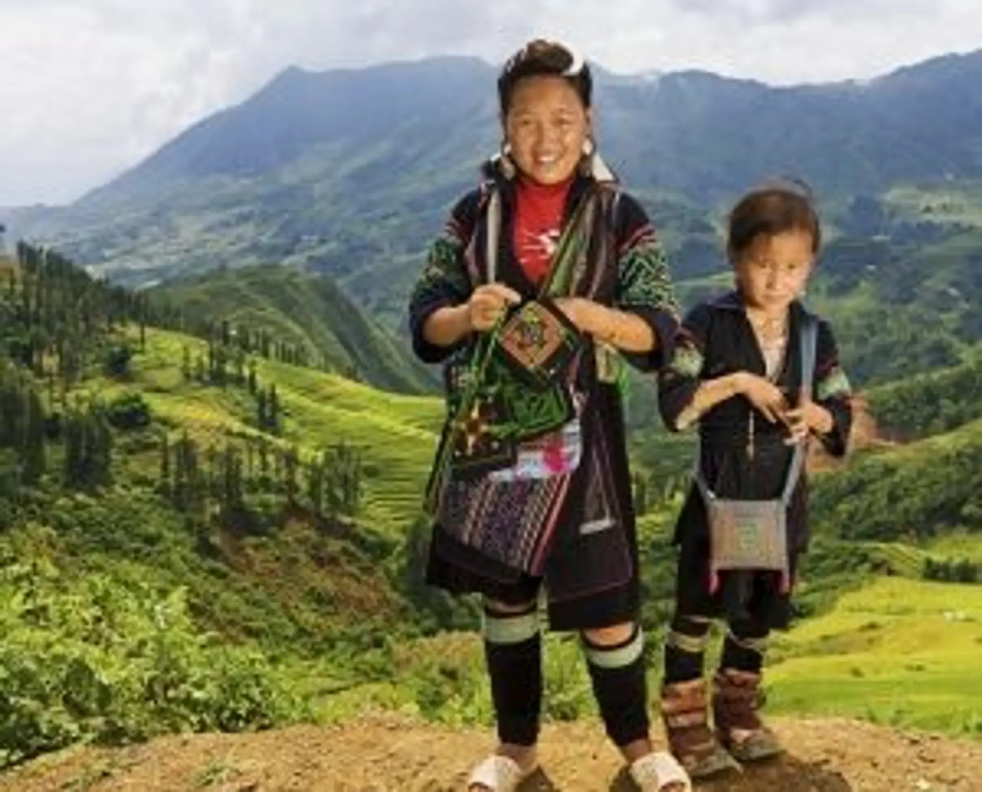Travel in Asia - Members of the Black Hmong hill tribe standing in a mountainous landscape in Vietnam
