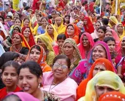 Travel in Asia - A very crowded street full of mostly Indian women in brightly colored traditional clothing