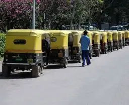 Travel in Asia - A lineup of auto-rickshaws on an Indian city street