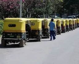 Travel in Asia - A lineup of auto-rickshaws on an Indian city street