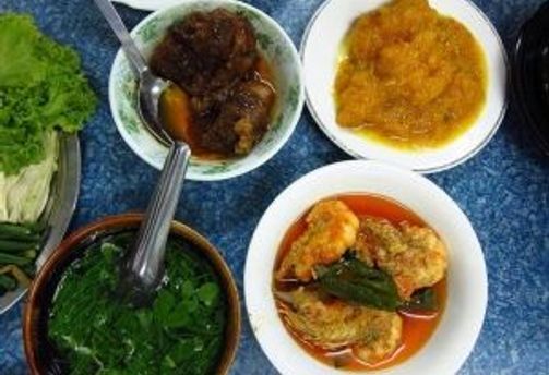 Travel in Asia - An assortment of dishes of Burmese cuisine on a table.