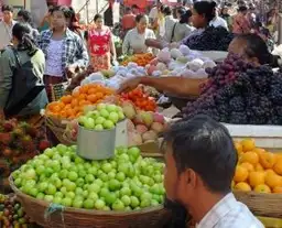Travel in Asia - A scene from a bustling fruit market in Myanmar.