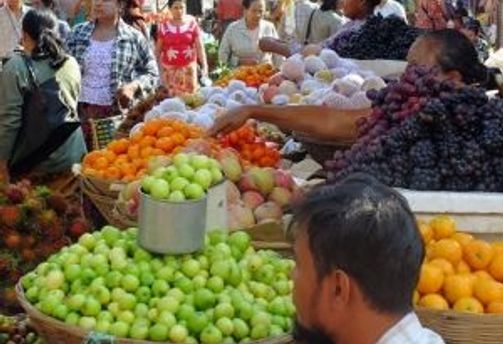 Travel in Asia - A scene from a bustling fruit market in Myanmar.