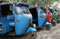 Travel in Asia - A row of parked auto rickshaws, or tuk-tuks, in Sri Lankan city