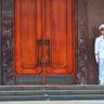 Travel in Asia - Two soldiers in white uniforms guard a wooden door outside the Ho Chi Minh Mausoleum in Hanoi, Vietnam