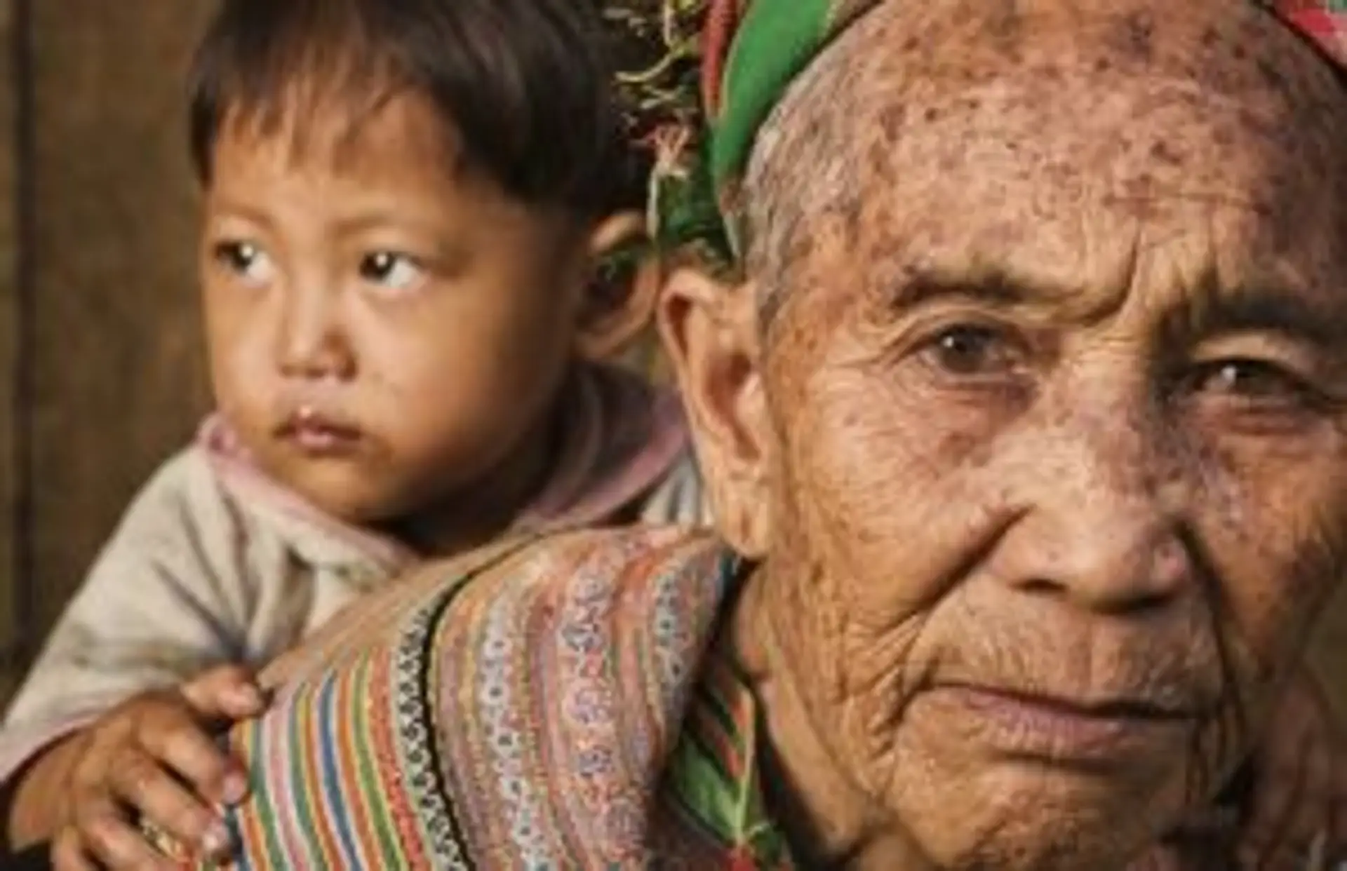 Travel in Asia - A grandmother from the Flower Hmong tribe in Vietnam with her granddaughter