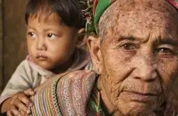 Travel in Asia - A grandmother from the Flower Hmong tribe in Vietnam with her granddaughter