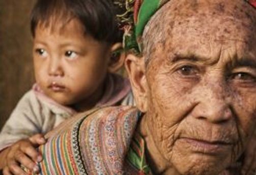 Travel in Asia - A grandmother from the Flower Hmong tribe in Vietnam with her granddaughter