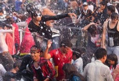 Travel in Asia - People splashing water on each other at the Thingyan water festival in Myanmar.