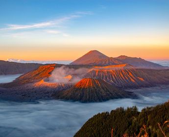 Travel in Asia - An aerial view of Mount Bromo rising above a sea of clouds in East Java, Indonesia