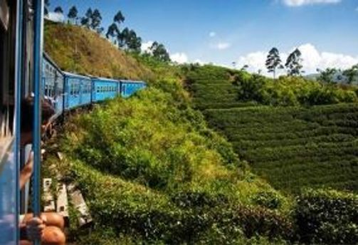 Travel in Asia - A train on a journey through the green hill country of Sri Lanka