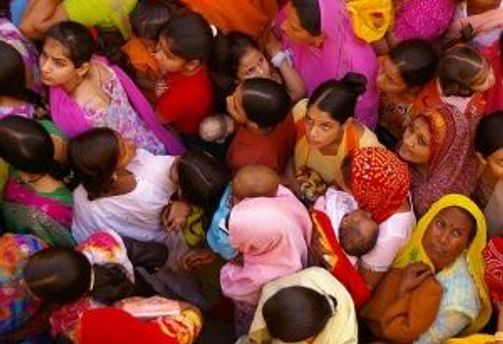 Travel in Asia - Women dressed in colorful clothing tightly crowded into the frame