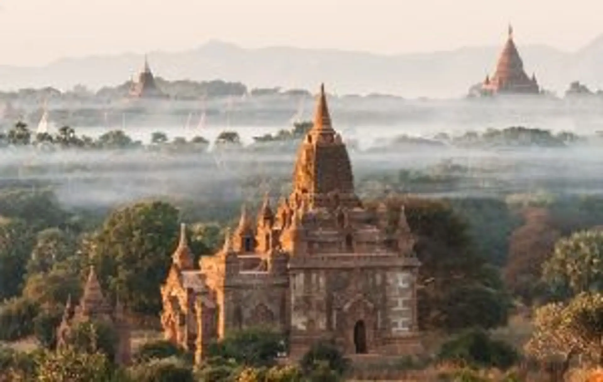 Travel in Asia - Temple buildings surrounded by morning mist in Bagan, Myanmar.