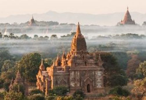Travel in Asia - Temple buildings surrounded by morning mist in Bagan, Myanmar.