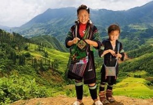 Travel in Asia - Members of the Black Hmong hill tribe standing in a mountainous landscape in Vietnam