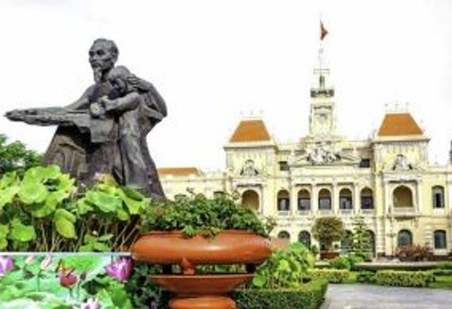 Travel in Asia - Statue of Ho Chi Minh in front of the People's Committee Building in Ho Chi Minh City, Vietnam
