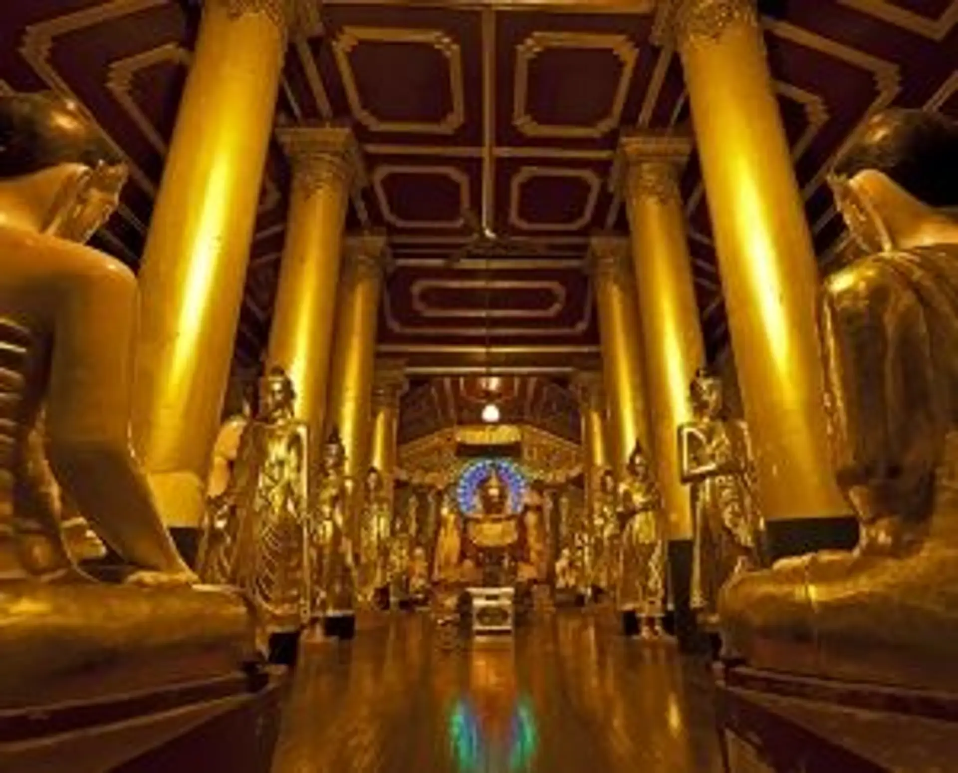 Travel in Asia - The golden interior of a Buddhist temple hall within the Shwedagon Pagoda complex in Yangon, Myanmar.